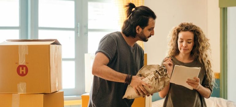 a man and woman making a moving plan