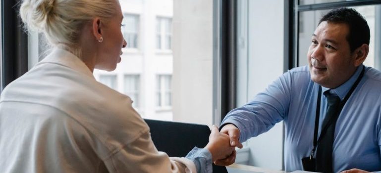 employer and employee shaking hands