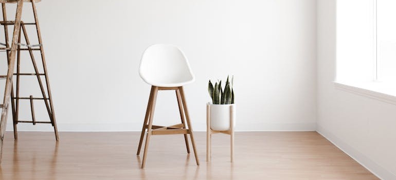 A chair and a pot inside a room