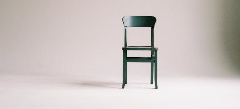 A green chair inside a room