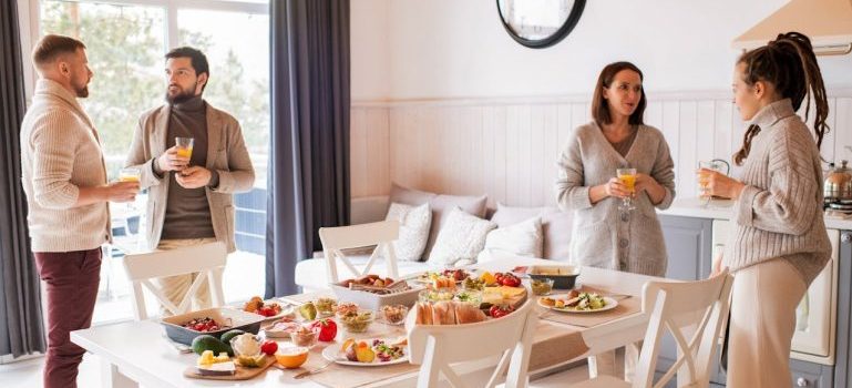 people standing near dining table
