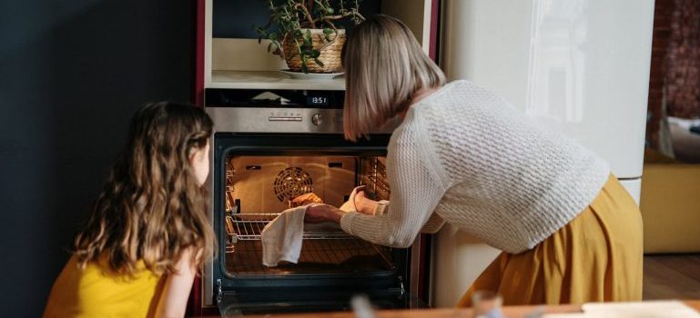woman and a girl baking something