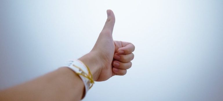 person doing thumbs up