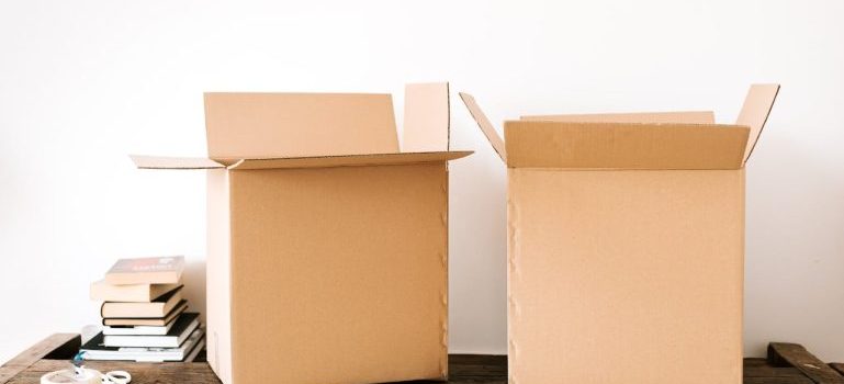 two empty boxes on a table