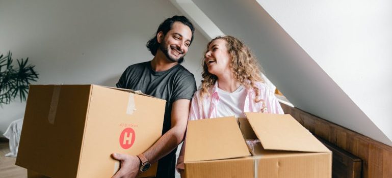 couple holding boxes