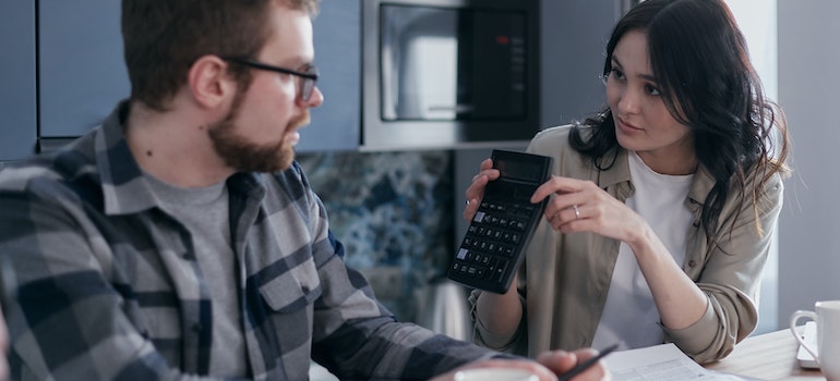 A couple budgeting for moving in the fall