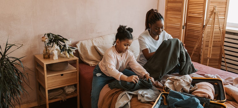 A mother and daughter unpacking