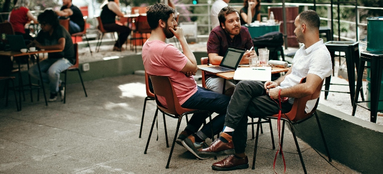 A group of people trying to learn how to find a remote job. 