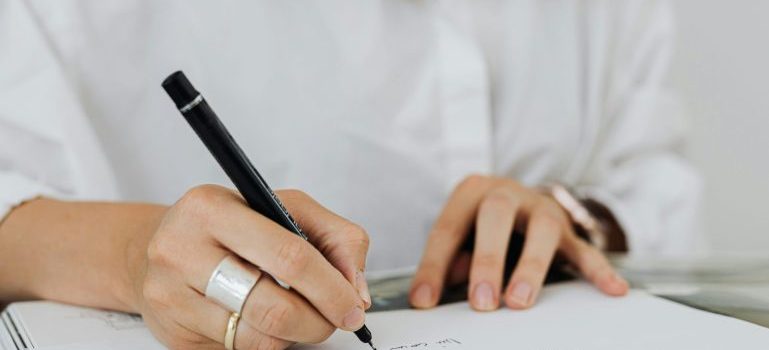 woman with her checklist after reading about how to prepare your home for winter after moving to Ottawa