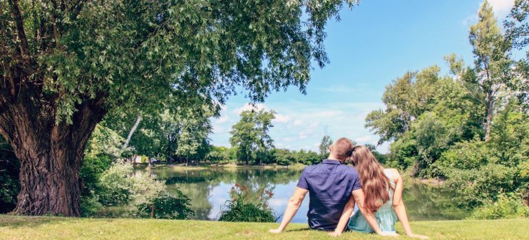 a couple sitting in a park
