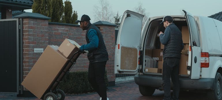 Movers unloading their van
