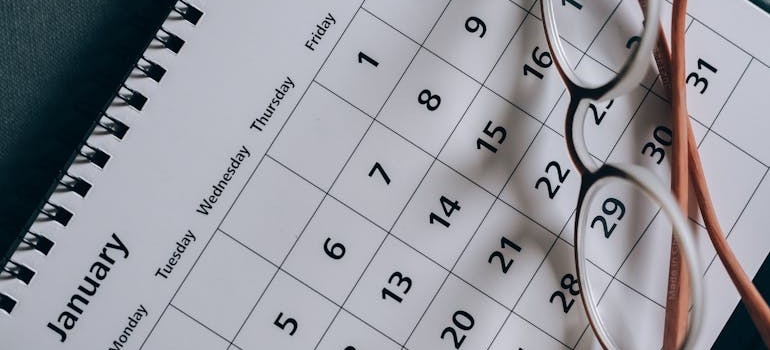 Glasses on top of a calendar