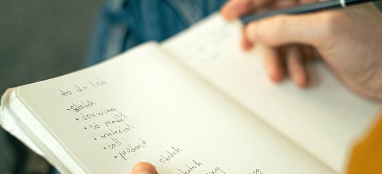 A person going over the dos and don’ts of packing a storage unit