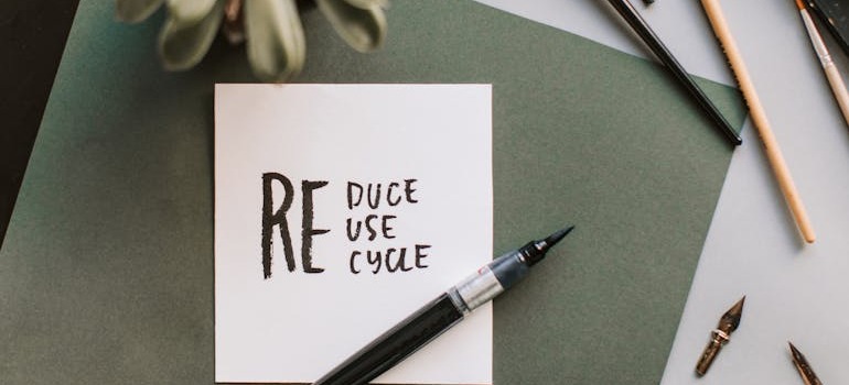 Reduce, reuse, recycle written on a piece of paper