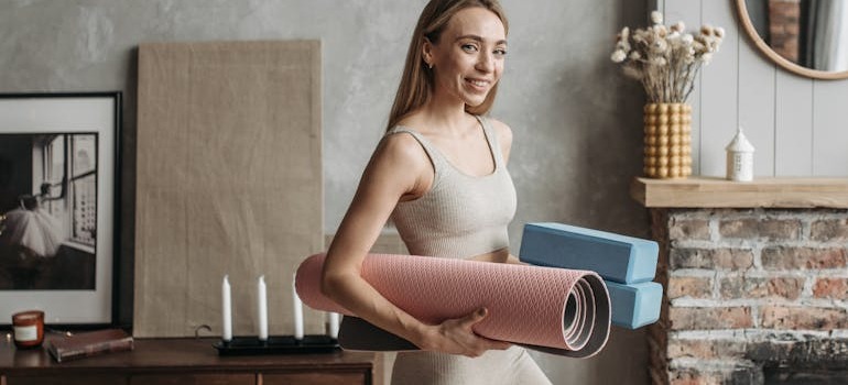 Your female friends helping you set up a home gym in your new home in Kanata