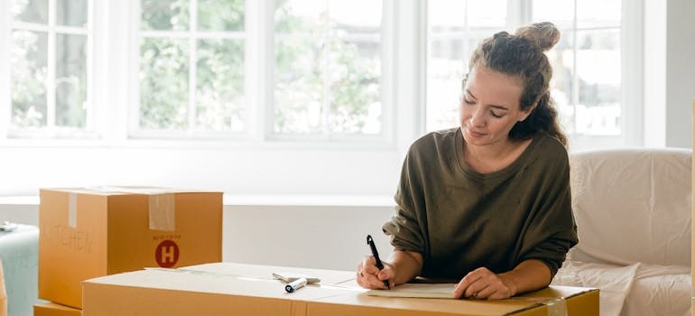 A woman making a plan for moving during the holiday season