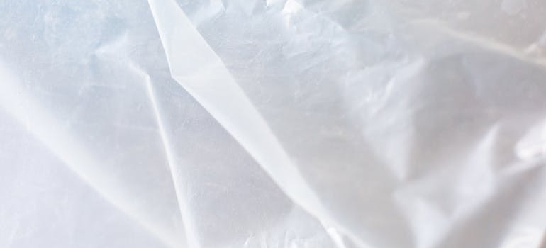 A white plastic sheet that can help you store outdoor equipment like grills and lawn tools in Ottawa