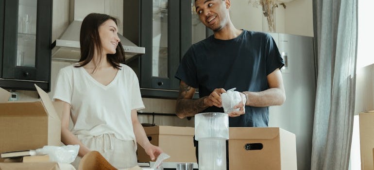 A couple unpacking belongings