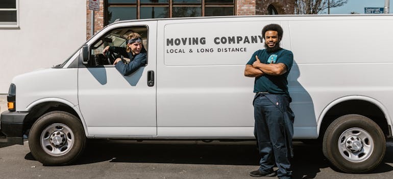 Movers in front of a van