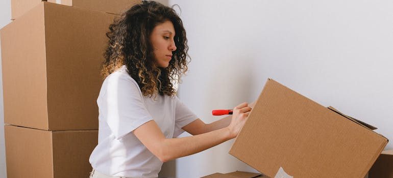 A friend helping you label boxes before the arrival of your movers in Kanata for your small move 