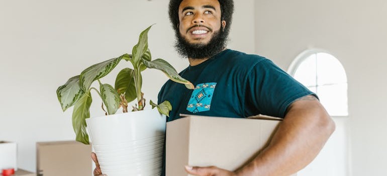 A mover holding a plant and moving box