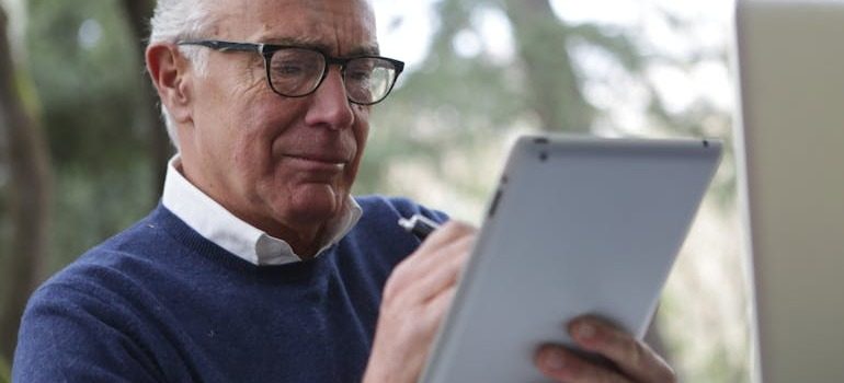 A man looking at his tablet