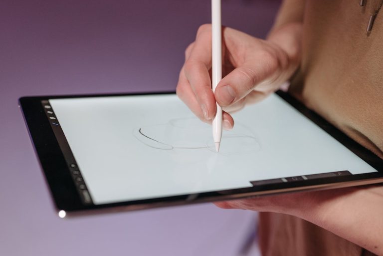 A person writing on a tablet about smart technology is changing the way we relocate in Ottawa