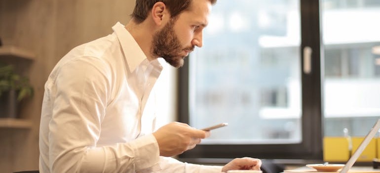 A man dialing a number to call as part of a backup plan for Ottawa residents