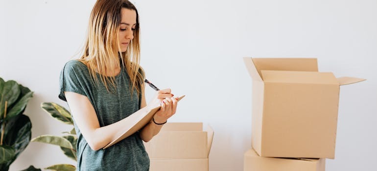 A woman going over her moving list