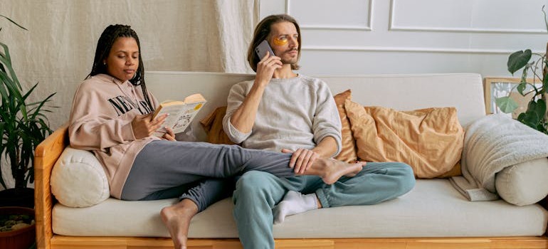 A couple relaxing at their new home