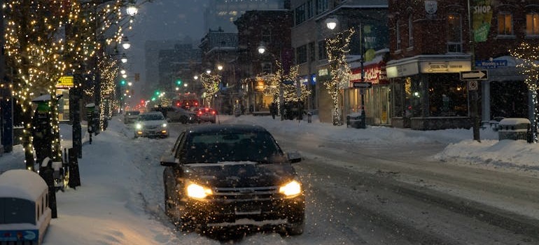 A car on a snowy road navigating Ottawa traffic & parking