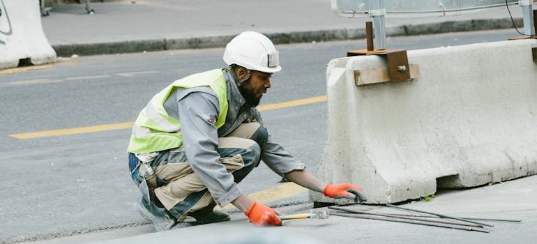 A man doing construction work on a street