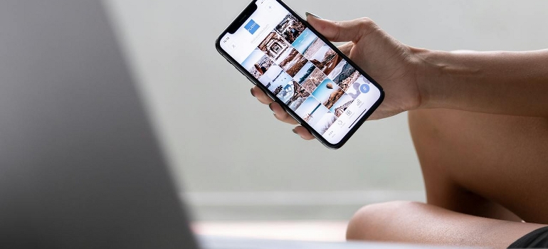 A person is holding a cell phone. 
