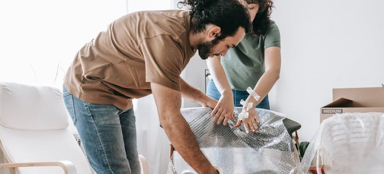 A couple covering furniture