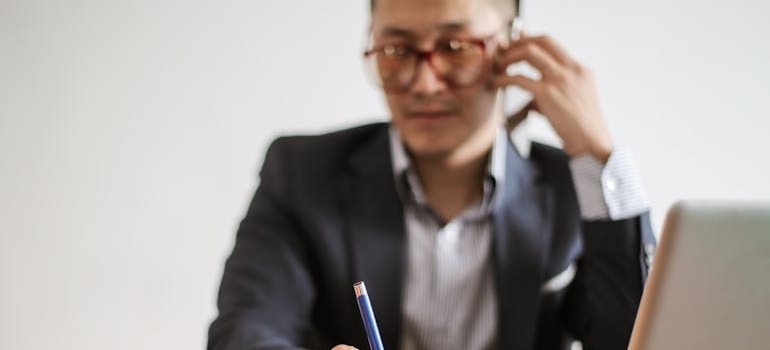 A man calling to find out about how to avoid extra fees when moving