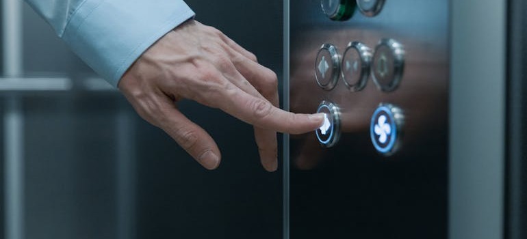 A person using an elevator while moving to a high-rise in Downtown Ottawa