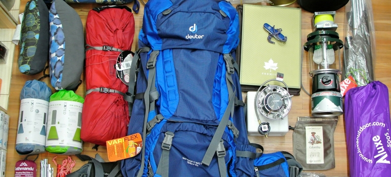 Assorted sports gear packed. 