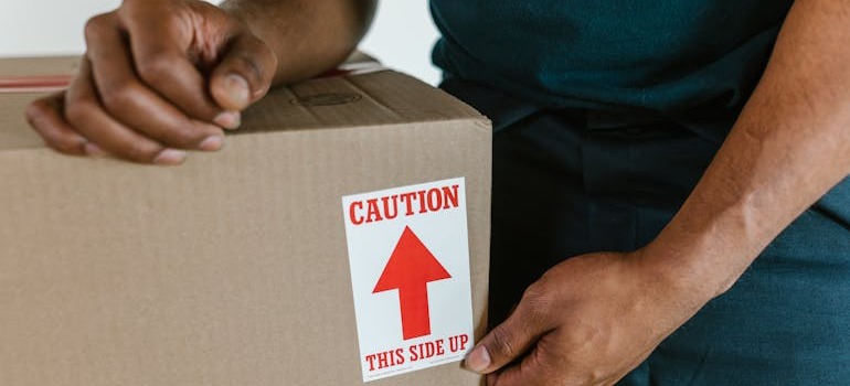 A mover beside a moving box