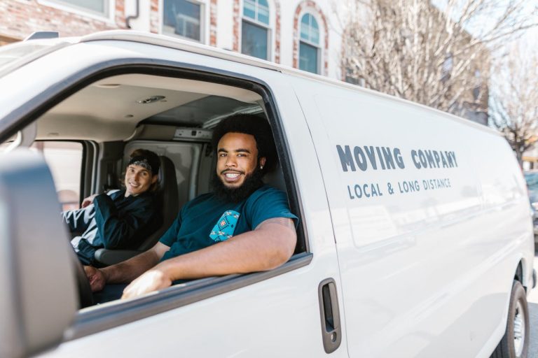 Movers inide a truck, explaining why hiring local Ottawa movers saves you time and stress