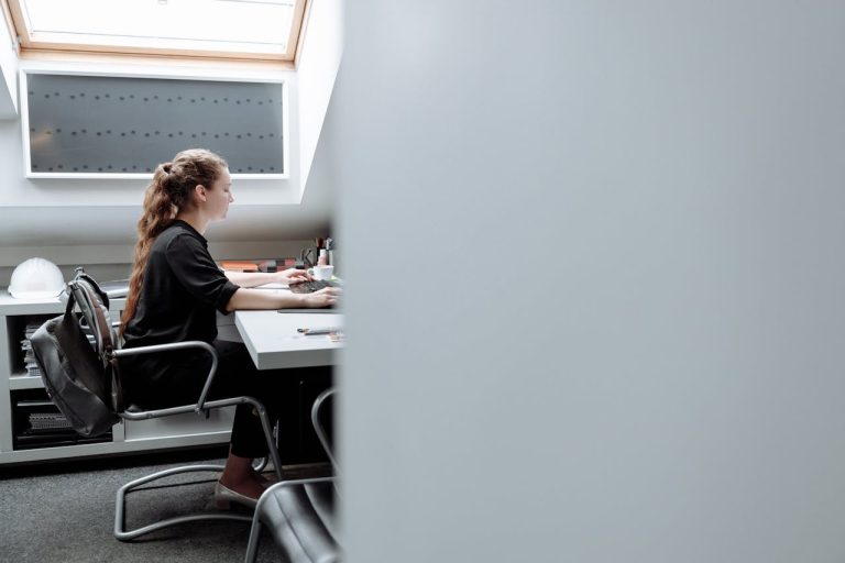 A woman sitting in her home office