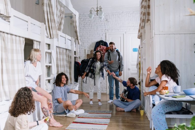Friends inside the dorm room are talking about moving into a college dorm.