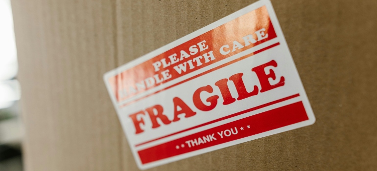 A Brown Carboard With a Sticker "Fragile"