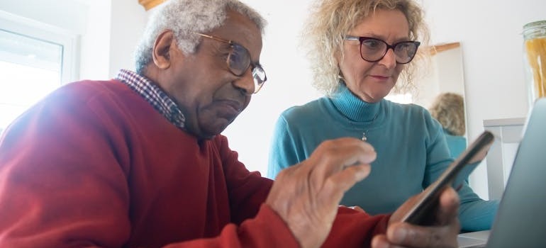 Two people analyzing information together
